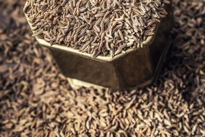 cumin-caraway-seeds-wooden-table-cumin-vintage-bronze-bowl-spoon_341862-1343